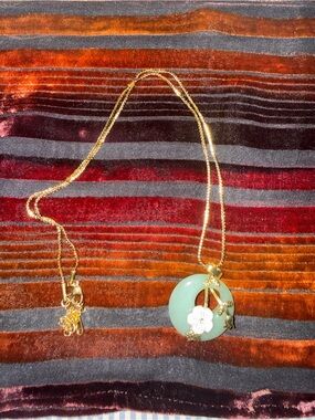 Gold Chain Necklace with Green Jade Circle Pendant and White Flower Accent